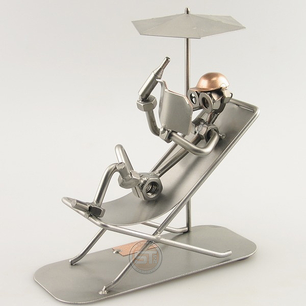 Steelman Sunbather reading on his lounge chair under an umbrella metal art figurine