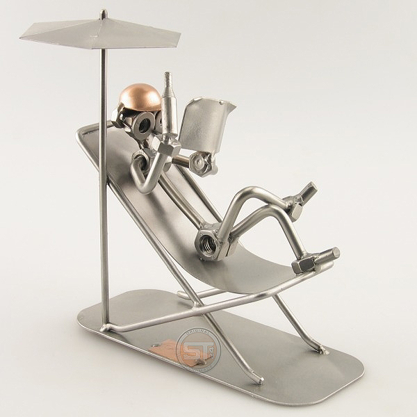 Steelman Sunbather reading on his lounge chair under an umbrella metal art figurine