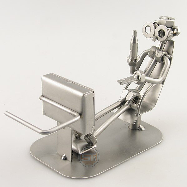 Steelman holding a beverage metal art figurine with a TV Remote Control Holder