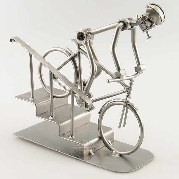 Steelman on a Mountain Bike going down a few steps metal art figurine