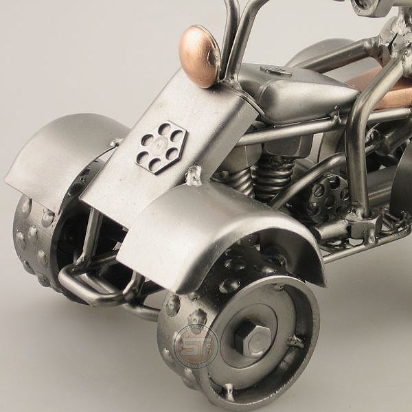 Steelman riding a Four Wheeler metal art figurine