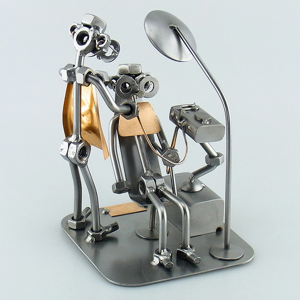 Steelman Dentist with a patient on the dental chair metal art figurine