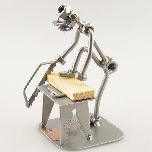 Do-It-Yourself SteelMan sawing a board metal art figurine