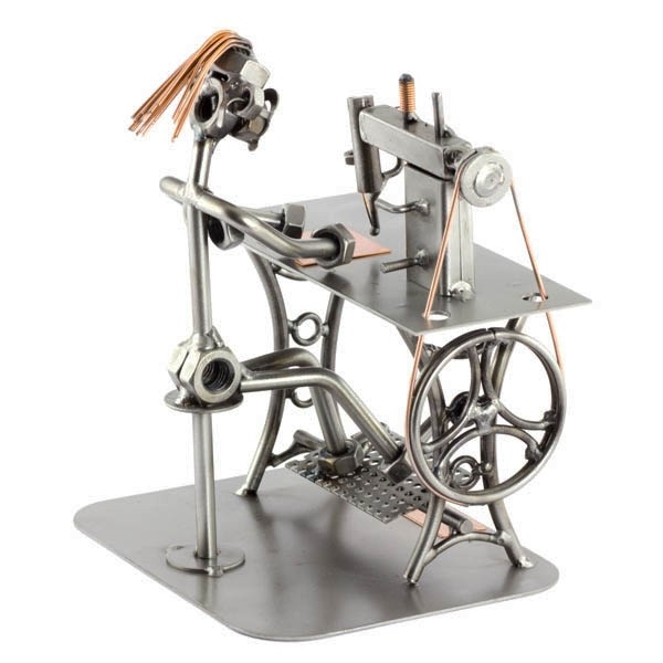 Steelman Seamstress sitting a her sewing machine metal art figurine