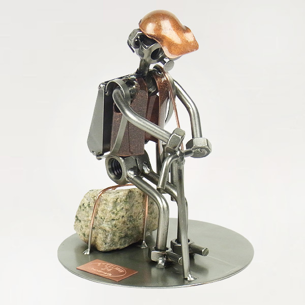 Steelman Hiker sitting on a rock metal art figurine