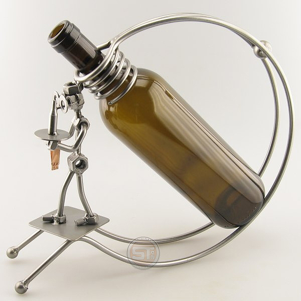 Steelman serving wine with a Wine Server metal art