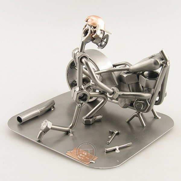 Steelman fixing a motorcycle metal art figurine