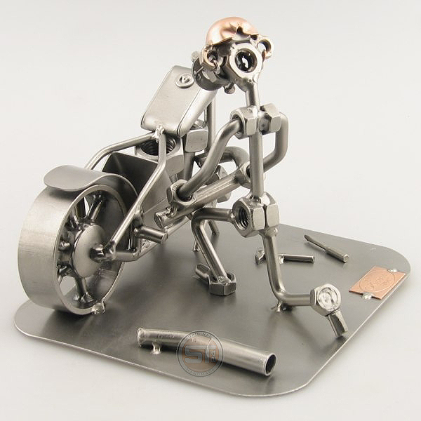 Steelman fixing a motorcycle metal art figurine