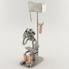 Steelman sitting In the Restroom holding a Tablet PC metal art figurine