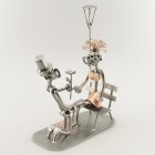 Female Steelman pushing a baby Carriage metal art figurine