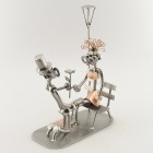 Stork holding a Baby on its beak metal art figurine