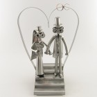 Steelman and a Steelgirl with a violinist on a Candle Light Dinner metal art figurine