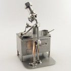 Steelman Pizza Chef pulling out a pizza from his brick oven metal art figurine
