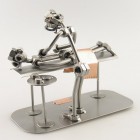 Steelman Cocktail Maker mixing a cocktail in a bar table with two bar stools metal art figurine