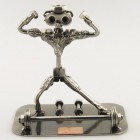 Steelman karate student in a high kick position metal art figurine