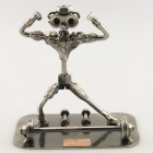 Steelman Fitness Trainer assisting a client metal art figurine