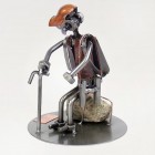 Steelman Lumberjack cutting a tree trunk with a chainsaw metal art figurine