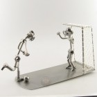 Two Steelman soccer players on a match metal art figurine