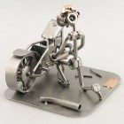 Steelman spray painting a car metal art figurine