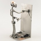 Steelman Tiler tiling a bathroom floor metal art figurine