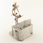 Steelman Engineer evaluating his project metal art figurine with a Desk Organizer