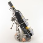 Steelman Mountaineer climbing to the top of a bottle of wine metal art figurine