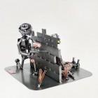 Steelman taking cover in a Paintball Game metal art figurine