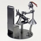 Steelman Masseur kneading the back of a patient metal art figurine