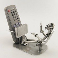 Steelman holding a beverage metal art figurine with a TV Remote Control Holder
