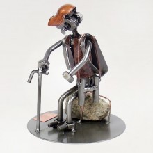 Steelman Hiker sitting on a rock metal art figurine