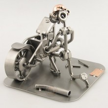 Steelman fixing a motorcycle metal art figurine