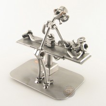 Steelman Chiropractor with a patient metal art figurine